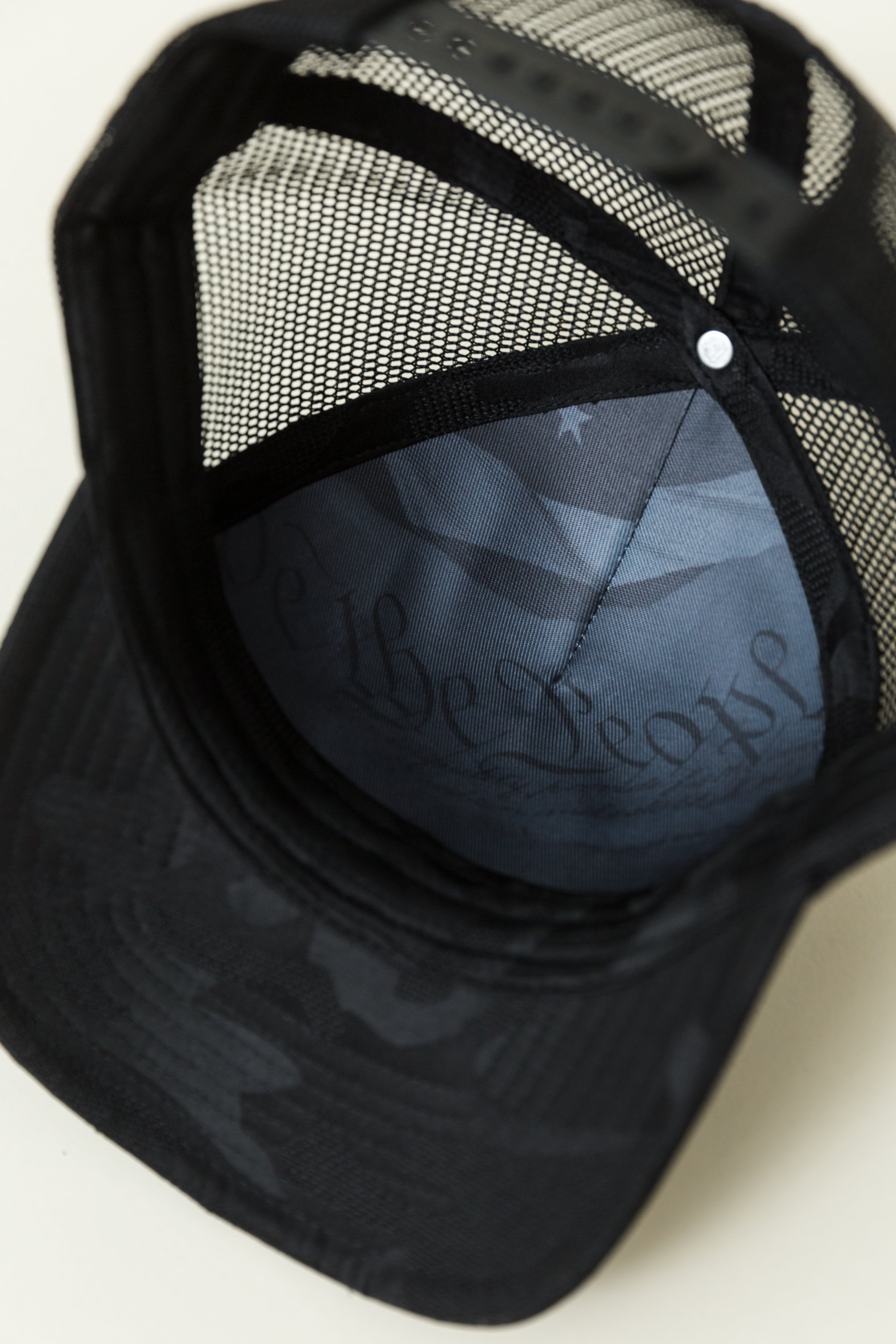 NRA® Dark Camo Trucker Circle Patch Cap