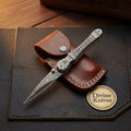 Engraved Damascus Liner-Lock Dagger Folder - Old-World Steel in Your Pocket