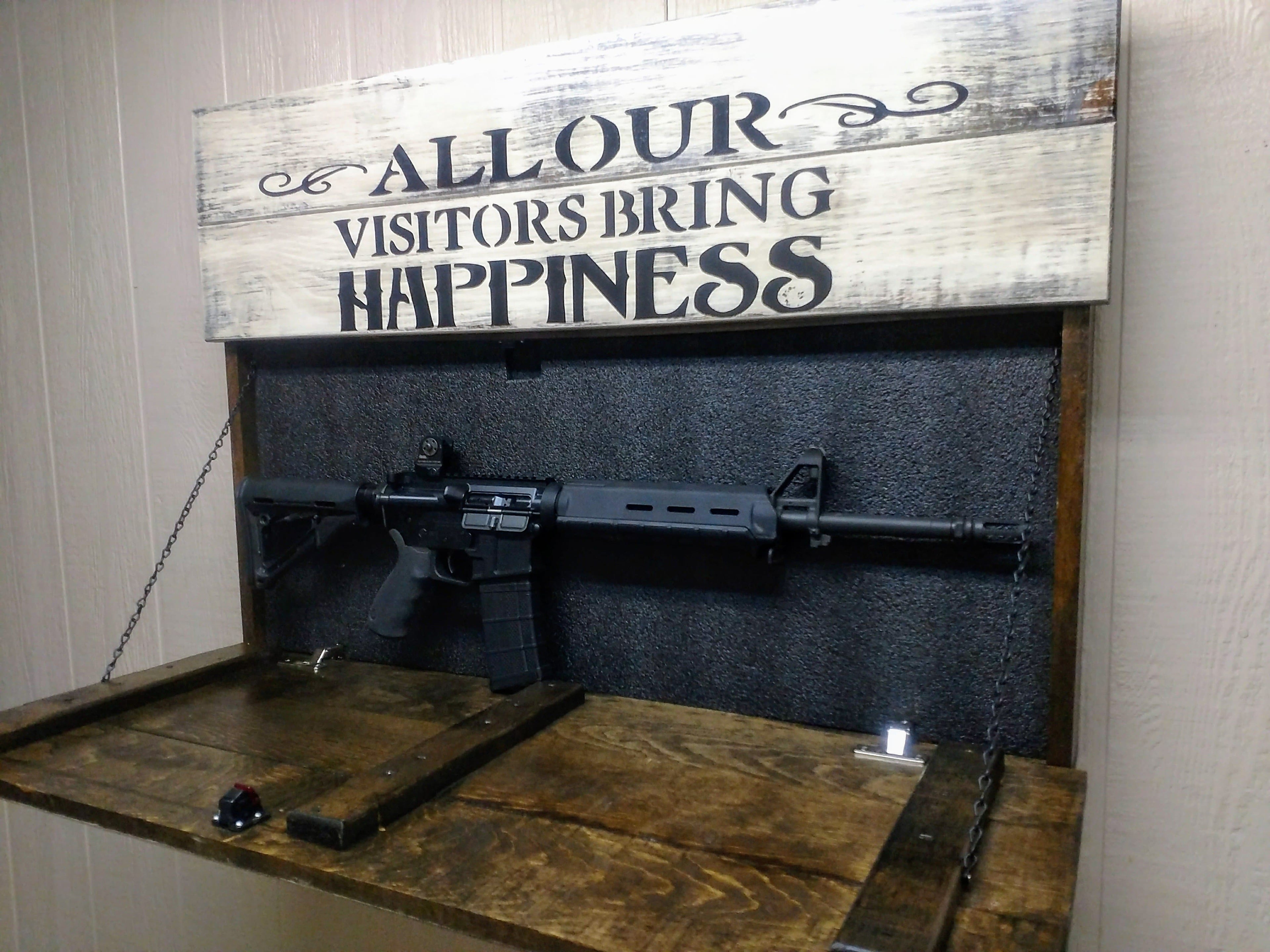 LARGE “VISITORS BRING HAPPINESS” GUN CONCEALMENT WALL ART